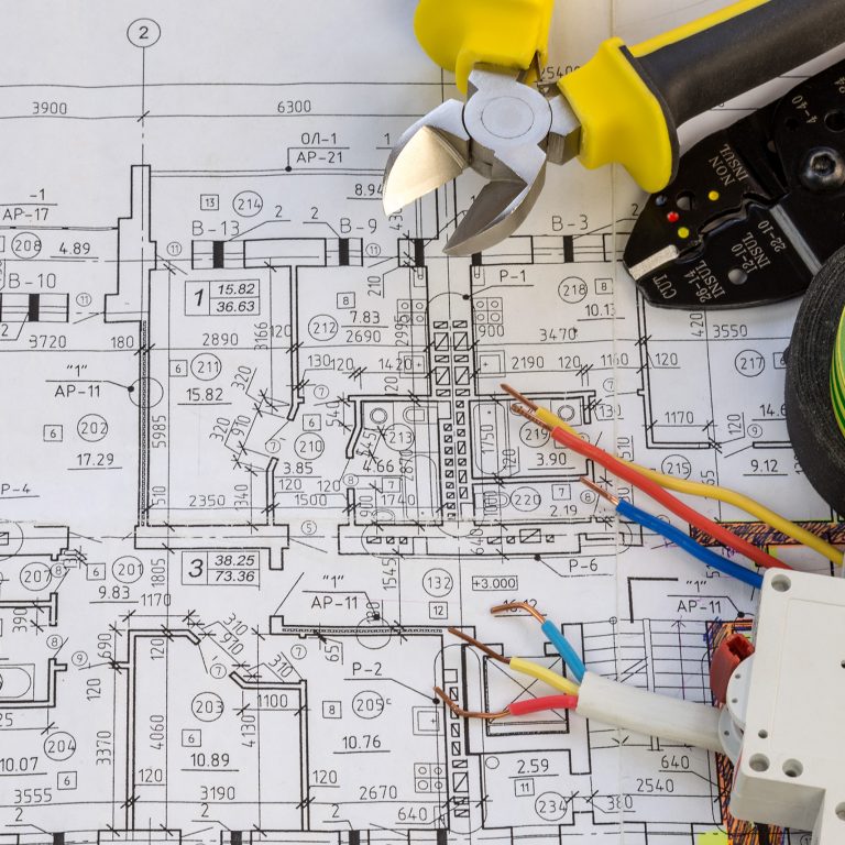 Still Life Of Electrical Components Arranged On Plans